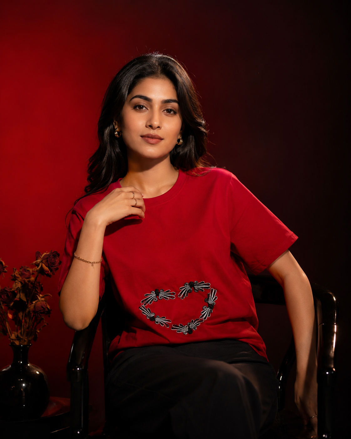 AI-generated editorial photoshoot for IZZ Habitus, red tee with heart motif against a moody red backdrop, dried roses