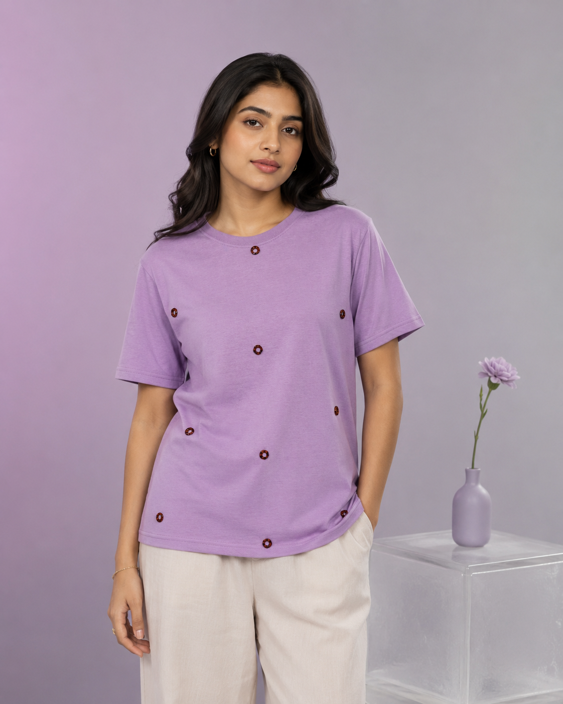 AI-generated editorial photoshoot for IZZ Habitus, lilac tee with scattered motifs against a lavender backdrop
